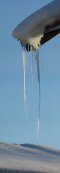 Icicles hanging from a roof in Arzl (Tyrol, Austria)